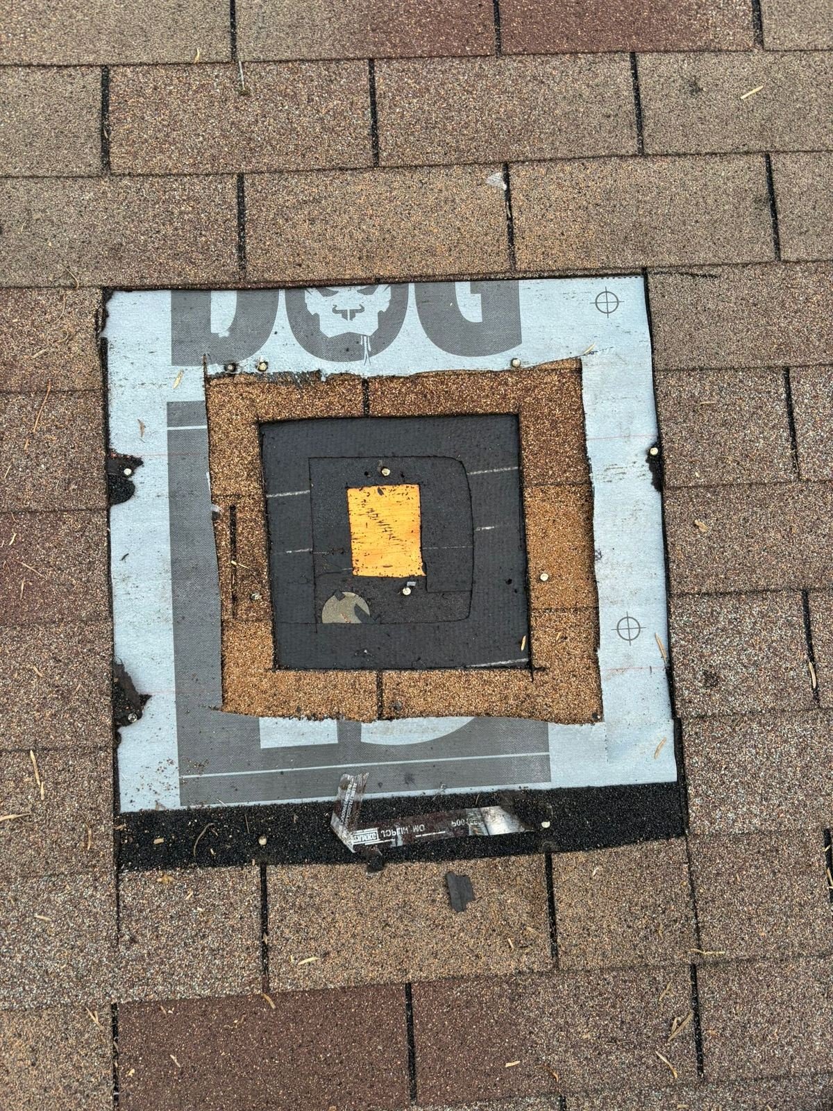 Layers of a roof system: decking, underlayment, and staged shingles