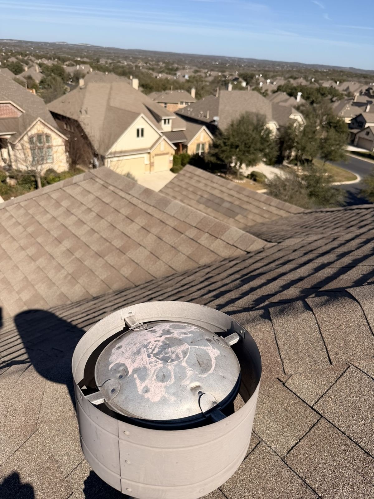 Hail impact marks chalked on a Master Flow roof vent cap