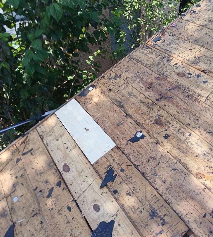 New decking board installed during a roof replacement
