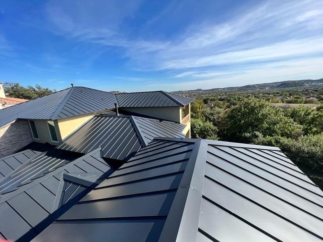 New standing seam metal roof on a hillside home