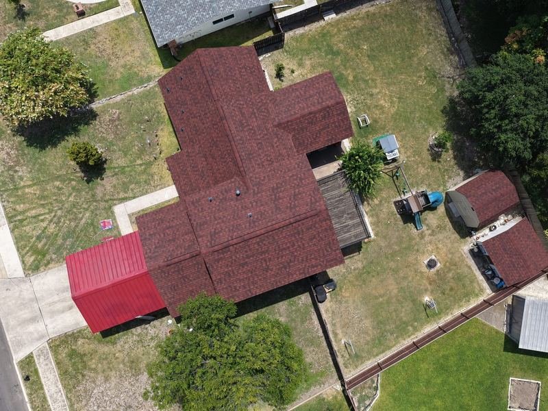 Aerial view of a new red shingle roof