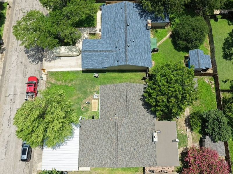 Aerial view of a new blue-gray shingle roof