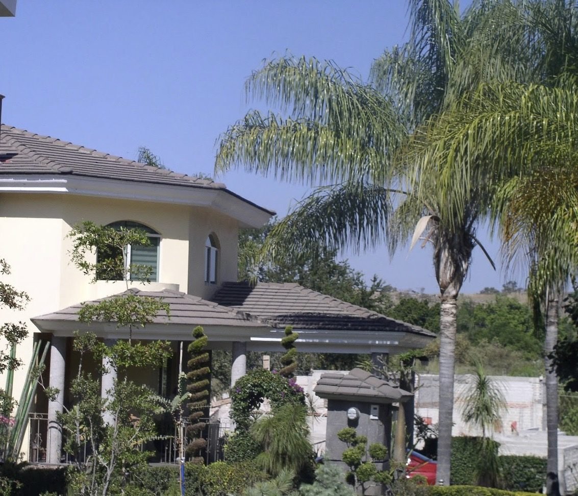 Home with a tile roof installed by Resilience Roofing and Restoration
